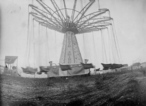 A black and white photo of an amusement park.