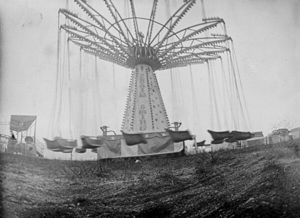 A black and white photo of an amusement park.