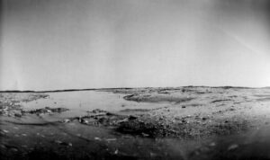 A black and white photo of the desert.