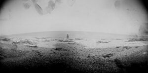 A black and white photo of the ocean.