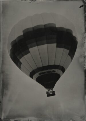 A black and white photo of a hot air balloon.