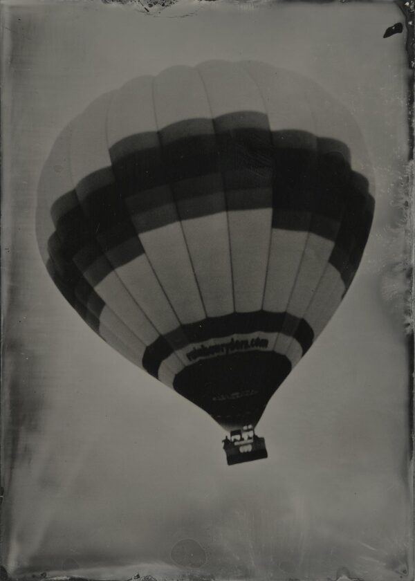 A black and white photo of a hot air balloon.