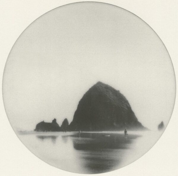 A black and white photo of a rock formation.
