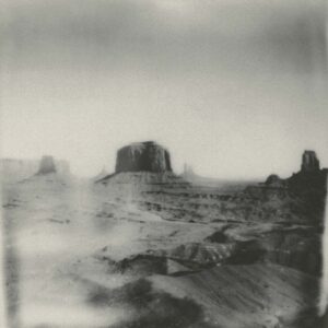 A black and white photo of the desert.