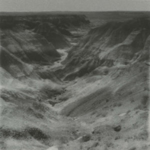 A black and white photo of some mountains