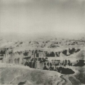 A black and white photo of some mountains