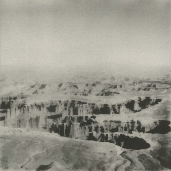 A black and white photo of some mountains