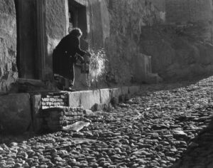 A person standing on the side of a building.