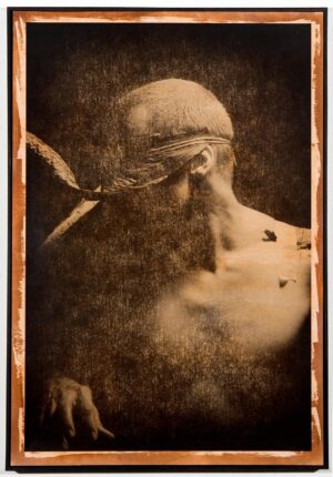 A man with a bird in his mouth.