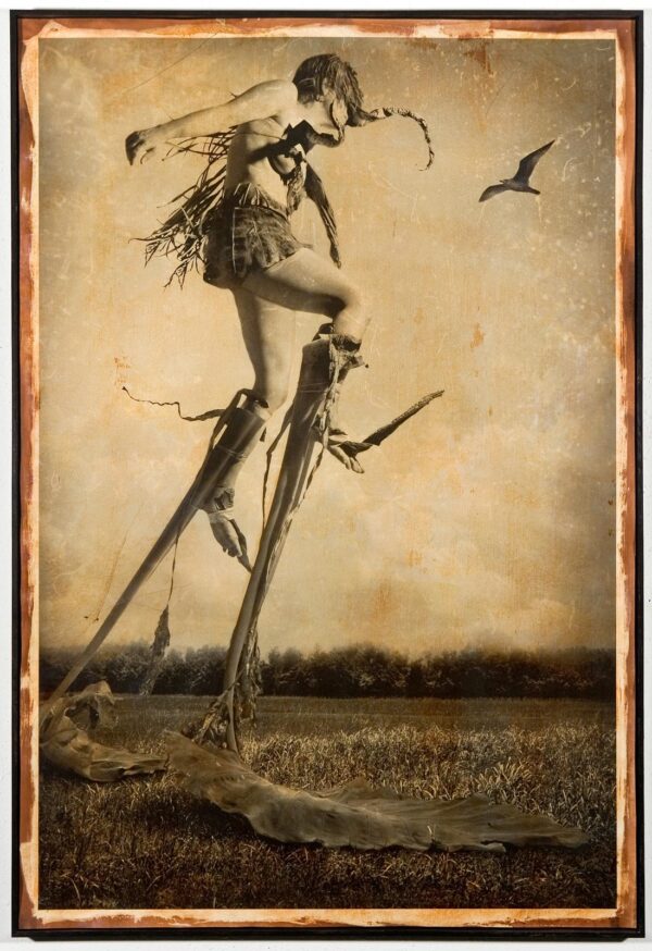A painting of a woman standing on top of a tree.