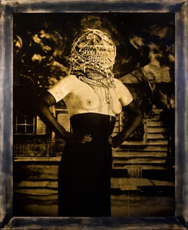 A woman with a face covered in chains.