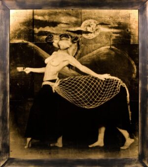 A woman in black and white is holding a net