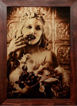 A woman holding flowers in her hand and wearing a crown.