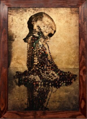 A painting of a skull with beads on it.