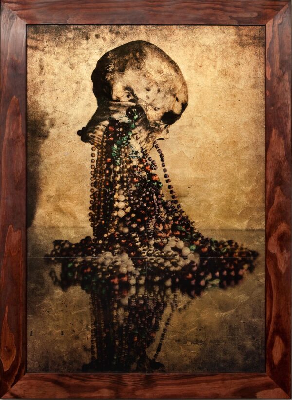A painting of a skull with beads on it.