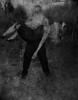 A blurry picture of someone holding something in their hand.