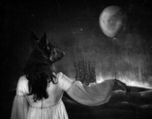 A woman in white dress with dog and moon.