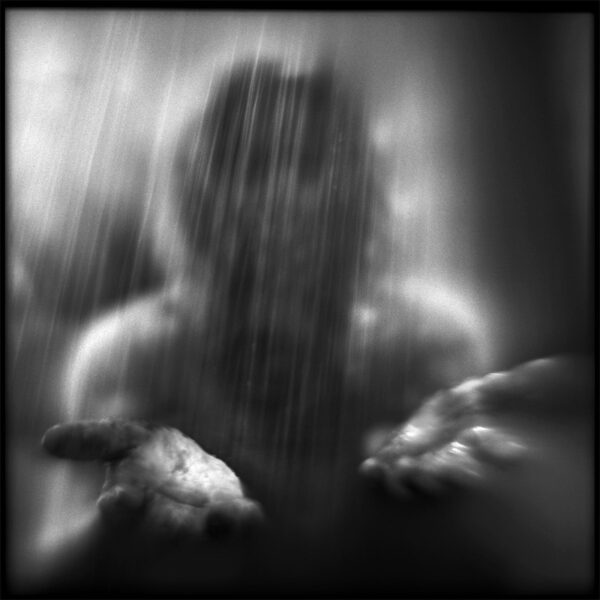 A blurry image of a person in the rain.