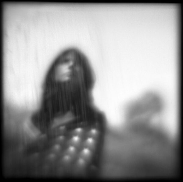A blurry picture of a person in the rain.