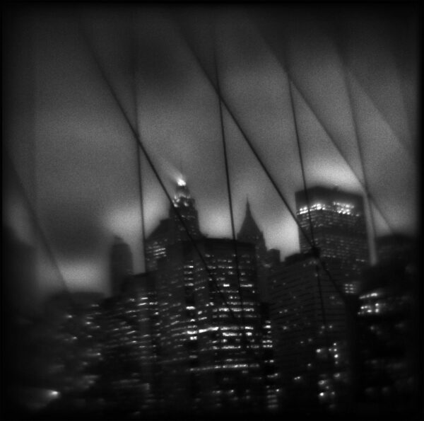 A black and white photo of buildings in the city.