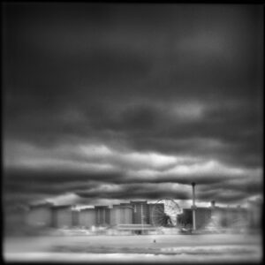 A black and white photo of a building in the distance.