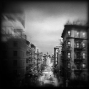 A black and white photo of buildings in the city.