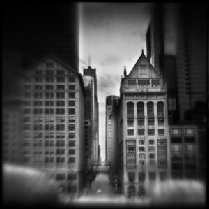 A black and white photo of buildings in the city.