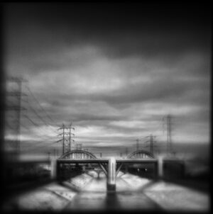 A black and white photo of an overpass.