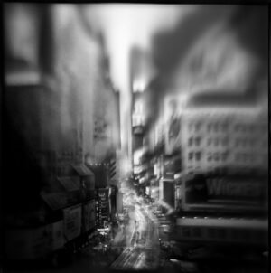 A black and white photo of an alley.