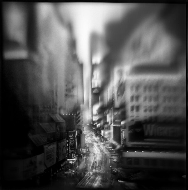 A black and white photo of an alley.