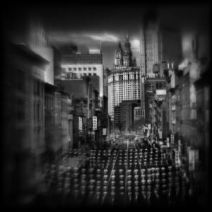A black and white photo of a city street.