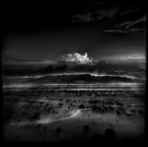 A black and white photo of the desert.