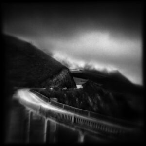 A black and white photo of a train on tracks.