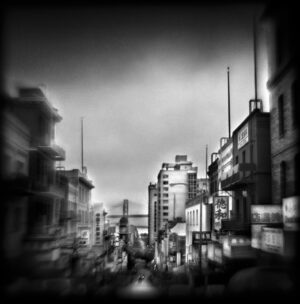 A black and white photo of a city street