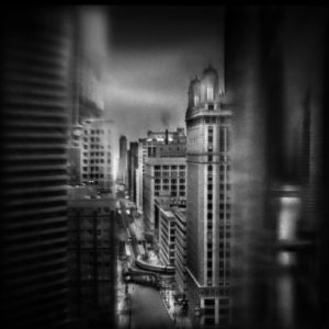 A black and white photo of buildings in the city.