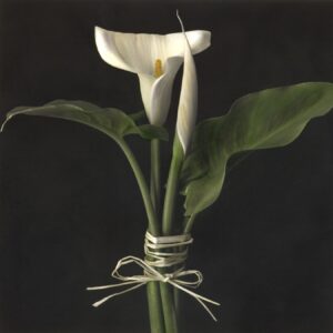 A white flower with green leaves in it.