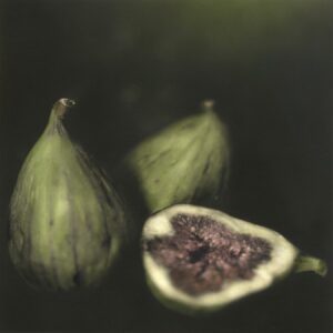 A painting of three figs with one cut in half.