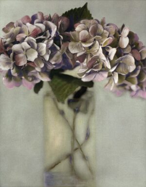 A vase with purple flowers in it