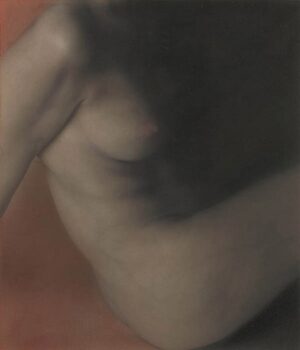 A blurry image of the back of a woman 's body.