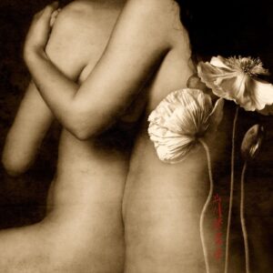 A woman standing next to a flower in sepia.