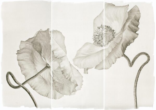 A black and white photo of flowers on a table