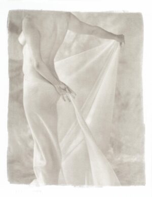 A woman in white dress holding onto a sheet