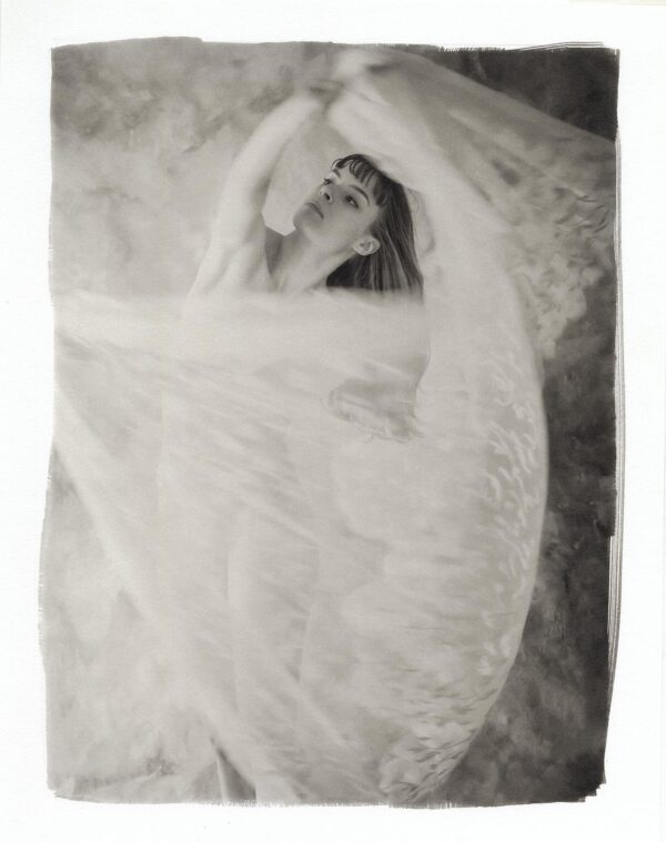 A woman in white dress holding onto the curtain