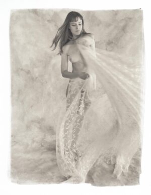 A woman in a long skirt and veil