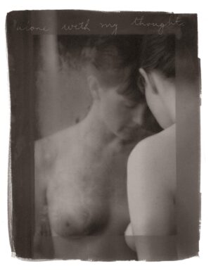 A man and woman are in the mirror.