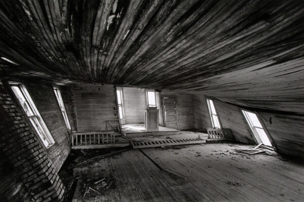A room with wooden floors and walls.