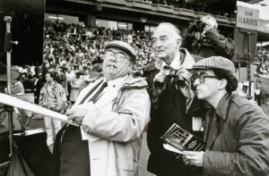 A group of men standing in front of an audience.