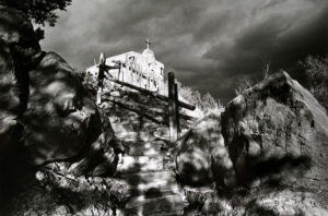 A black and white photo of some steps leading up to the top.