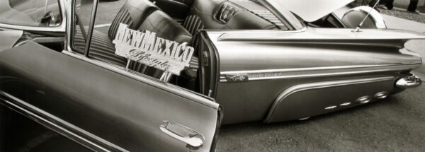 A black and white photo of an old car.