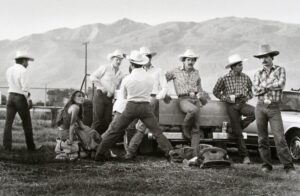 A group of men in cowboy hats and white shirts.
